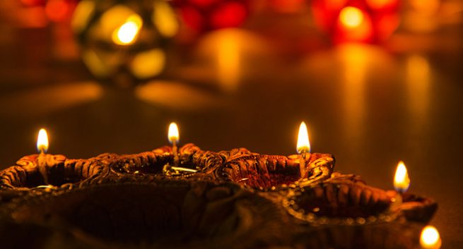 4 Diyas adjacent to each other to celebrate Diwali